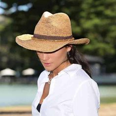 Raffia cowboy hat for women. Stylish western style hat. Wired brim, 3.25" wide, allows you to shape it as you like it. Contrast color band with stone beads accent. Dented crown with front pinch. "Wallaroo" logo accent. Inner drawstring to reduce size. Medium / large hat size, fits up to 58 cm. 100% raffia. Short Brim Straw Sun Hat For Rodeo, Straw Sun Hat For Country Events, Western Straw Brimmed Fedora, Western Style Fedora Straw Hat For Outdoor, Wide Brim Straw Hat For Rodeo, Straw Fedora Sun Hat For Rodeo, Fedora Straw Sun Hat For Rodeo, Rodeo Straw Fedora Sun Hat, Straw Fedora Hat For Rodeo