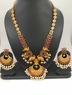 Goddess Lakshmi Peacock Red Stone Chandbali Pattern Necklace with Chandbali Very elegant and traditional necklace for this festive season. Premium quality and craftmanship Necklace Length : 18 Inches;  Earring Length : 2.5 Inches Screw Back Ready to ship from Boston, MA If you have any questions please let me know. Chandbali Peacock Design Temple Necklace For Celebrations, Festive Chandbali Temple Necklace With Peacock Design, Peacock Design Chandbali Temple Necklace For Celebration, Bollywood Temple Necklace With Peacock Design For Diwali, Bollywood Style Temple Necklace With Peacock Design For Diwali, Festive Red Necklace With Latkans, Festive Temple Necklace With Peacock Design For Navratri, Festive Navratri Temple Necklace With Peacock Design, Bollywood Temple Necklace With Peacock Design For Festivals