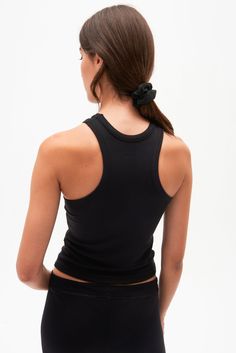 A high racer front and back neckline add a bit of sophistication to our classic tank. Super soft baby rib fabric to hug your body and layer effortlessly. BEST FOR: running, yoga, CrossFit, barre, Pilates, spin class and gym workouts. Model is 5'10" and wears a size small. NEW LONGER LENGTH Fitted T-back Tank Top For Yoga, Black Seamless T-back Tank Top, Racerback Tank Top For Yoga, Fitted Seamless T-back Tank Top, Sporty Fitted Tank Top With T-back, Fitted Sporty T-back Tank Top, Sporty Fitted T-back Tank Top, Black High Stretch Scoop Neck Tank Top, Black Scoop Neck High Stretch Tank Top