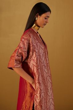 Red kaftan featuring floral patterns in Mughal brocade with minimal zardozi embroidery. Paired with red cotton silk pant with partially elasticated waistband and pockets., Fit: Relaxed Red Kaftan With Kimono Sleeves For Festive Occasions, Brocade Dupatta With Dabka For Festive Occasions, Festive Brocade Dupatta With Dabka Details, Festive Brocade Dupatta With Dabka, Bollywood Style Brocade Dupatta With Dabka, Bollywood Brocade Dupatta With Dabka, Festive Red Kaftan With Kimono Sleeves, V-neck Traditional Wear For Eid, Traditional Drape Kurta For Rituals