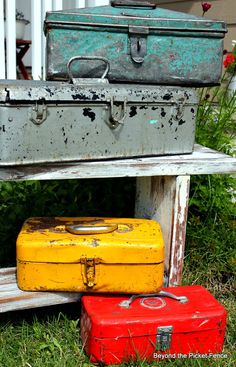 three suitcases are stacked on top of each other in front of an old house