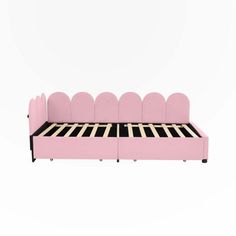 a pink bed with black and white lines on the headboard, sitting in front of a white background