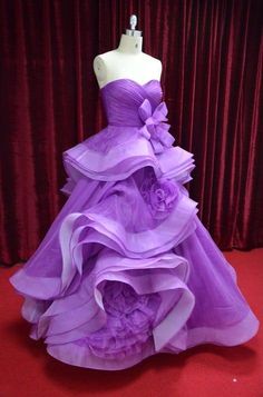 Darius Cordell Fashion Ltd offers this purple formal ball gowns as shown or with any changes.  Please contact us for options and details about our process for ordering custom ball gowns.