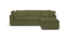 a green sectional couch with pillows on it