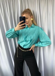 The turquoise color is a beautiful and vibrant shade that is perfect for adding a pop of color to any outfit.  When styling this blouse, you can pair it with a variety of different items to create a chic and sophisticated look. For example, you could wear it with a pair of high-waisted trousers or a pencil skirt for a more formal occasion. Alternatively, you could pair it with a pair of jeans and some cute flats for a more casual look. - Good vintage condition (no visible sings of wear) - TAG SI Elegant Solid Color Summer Shirt, Trendy Summer Blouse With Ruffled Collar, Elegant Light Blue Summer Shirt, Trendy Solid Color Blouse, Spring Green Ruffled Shirt, Elegant Blue Top With Ruffled Collar, Elegant Green Cotton Blouse, Chic Light Blue Office Shirt, Chic Light Blue Shirt For Office