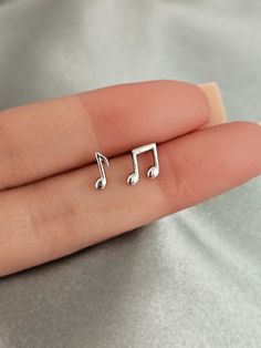 Musical notes stud earrings. These sterling silver musical notes earring studs are the perfect choice for any music lover looking to add a touch of musical charm to their daily look. Minimalist design, crafted from high quality, hypoallergenic sterling silver, these earrings are light and comfortable for all day wear without causing irritation or discomfort to sensitive skin, making them the ideal gift for any musician or music enthusiast. Finish: platinum  or 18k gold  plated over sterling silv Music-themed Silver Earrings, Earrings Aesthetic Stud, Silver Earrings Aesthetic, Music Note Earrings, Music Earrings, Daily Earrings, Silver Butterfly Earrings, Music Jewelry, Stud Earrings Gold