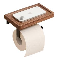 a cell phone sitting on top of a wooden holder with a roll of toilet paper