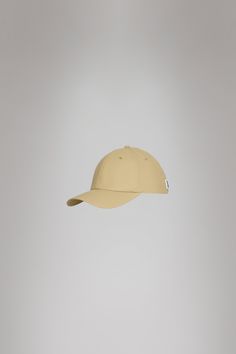 Cap is Rains' take on the classic baseball cap with 6 panels and curved brim. The Cap is characterized by a curved brim and six-paneled design held in place by a back-mounted adjustable webbing strap and buckle. It features eyelets to ensure ventilation for breathable comfort. Cap is cut from Rains' signature PU fabric. The finish is lightweight with a smooth feel. Pu Fabric, Webbing Strap, Baseball Caps, Black And Navy, Baseball Cap, Cape, Buckle, Baseball, Fabric