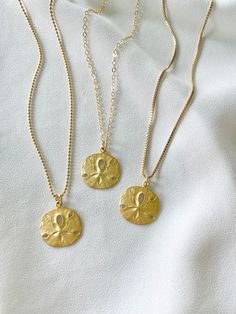 **Each piece in my shop, I personally create and photograph. (All photos are property of The Cord Gallery LLC) Thank you for supporting my small business. These stunning Medallion Necklaces are perfect stand alone and layering pieces. Features a Sand Dollar Coin Medallion with lots of rustic texture and interest. Made from Matte Gold Vermeil (18k Gold plated over 925 Sterling Silver).*Pendants measure 18mm in diameter (including bail)Hangs on your choice of chain:*14k Gold Filled Link Chain *14k Gold Jewelry With Lobster Clasp For Birthday, Handmade Gold Jewelry For Birthday Gift, Spiritual Gold Charm Necklaces For Birthday Gift, Spiritual Gold Charm Necklace For Birthday Gift, Spiritual Box Chain Necklace Gift, Spiritual Box Chain Necklace As Gift, Gold Charm Necklaces With Box Chain For Gifts, Gold Charm Necklace With Box Chain For Gifts, Gold Charm Necklace With Box Chain As Gift