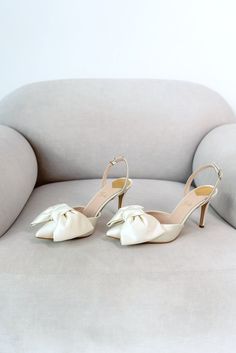 Bridal shoes 'JENNA' are handcrafted from soft Italian satin and have a 9 cm / 3.5 inches pointy heel.  Elegant yet minimalistic wedding sandals will perfectly complement your wedding gown. Sandals decorated with a fabulous satin bow. Can be made with lower heels. Inside there is a soft Memory foam insole, which gives a feeling of additional comfort when walking. Tunit outsole is made of a mixture of leather chips and rubber, it's more wear-resistant than leather and more durable. Also, we use s Wedding Dresses Shoes, Wedding Shoes Bows, Elegant Cream Slingback Pumps With 4-inch Heel, Summer Wedding Slingback Pumps With 4-inch Heel, Elegant Wedding Heels With Bow Straps, Wedding Slingback Sandals With 4-inch Heel And Pointed Toe, High Heel Wedding Sandals With Bow, Elegant Pointed Toe Sandals For Wedding Guests, Wedding High Heel Sandals With Bow