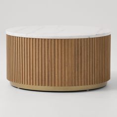 a round wooden table with white marble top