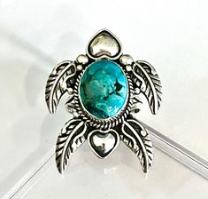 🦋🦋 Charming Vintage Navajo Turtle Design Sterling Silver Candelaria Turquoise Ring Markings "STERLING" Verified  Candelaria Turquoise  Gorgeous traditional stamp work High polish Sterling Silver Larger Size Statement Ring  Total Weight ~ 11 grams Size 8 3/4 US Setting ~ 4 x 3cm Band ~ 3-8mm Turquoise ~ 1.25 x 1.5 x 0.6cm depth The Candelaria Hills in Southwest Nevada are home to dozens of turquoise mines, large and small. Candelaria turquoise comes from the silver mine owned by the Silver Stan Adjustable Traditional Turquoise Ring, Traditional Turquoise Rings Collectible, Traditional Adjustable Turquoise Ring, Traditional Adjustable Turquoise Ring As Gift, Adjustable Traditional Turquoise Ring As Gift, Traditional Adjustable Turquoise Ring For Gift, Traditional Turquoise Inlay Ring, Turtle Design, Statement Art