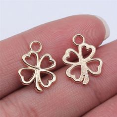 Our KC gold Four Leaf Clover Charms are made from zinc alloy metal and are lead and nickel-free.  They're perfect for crafting necklaces, bracelets, earrings, bookmarks, key chains, and more!    ♥ Bright KC Gold Four Leaf Clover Charms  ♥ Material: Zinc Alloy Metal   ♥ Size: 17mm x 14mm   ♥ Includes: 15 pieces    We ship from North Carolina via USPS with tracking included. Tracking is included with all orders.   Get free shipping on orders over $35!  Don't forget to favorite us too, we add items daily.   Thank you... craft on. Gold Charms Nickel Free For Gift Making, Gold Nickel-free Charms For Gift Making, Gold Four Leaf Clover, Clover Flower, Clover Charm, Antique Pendant, Four Leaves, Four Leaf, Leaf Clover