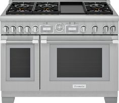 a silver stove top oven with two burners on each side and one door open