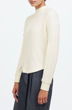 Made of cozy, textural waffle knit, this long-sleeved tee features a ribbed crew neckline and sporty raglan sleeves. Laid-back and oversized, it's the perfect blend of cute and comfy. 22 1/2" length (size Medium) Crewneck Long sleeves 50% viscose, 30% polyester, 20% polyamide Machine wash, dry flat Imported Fall Layering Waffle Knit Sweatshirt, Fall Waffle Knit Sweatshirt For Layering, Relaxed Fit Waffle Knit Crew Neck Top, Spring Textured Knit Long Sleeve Crew Neck Top, Spring Crew Neck Long Sleeve Top With Textured Knit, Winter Waffle Knit Sweatshirt For Layering, Everyday White Waffle Knit Tops, White Waffle Knit Top For Loungewear, Crew Neck Waffle Knit Sweatshirt For Layering