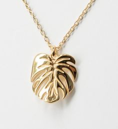 Inspired by my very own Monstera deliciosa, this gorgeous Monstera Deliciosa leaf necklace is plated in White Gold and has a Mirror- like finish. This is a stunning necklace that makes the perfect gift the nature enthusiast. | Inspired by my very own Monstera deliciosa, this gorgeous Monstera Deliciosa leaf necklace is plated in White Gold and has a Mirror- like finish. This is a stunning necklace that makes the perfect gift the nature enthusiast. | 1-800-Flowers Gifts Delivery Monstera Delicios Leaf-shaped Yellow Gold Necklace, Leaf-shaped Yellow Gold Necklace For Gift, Leaf-shaped Yellow Gold Plated Jewelry, Yellow Gold Plated Leaf-shaped Jewelry, Gold Plated Leaf-shaped Jewelry, Gold Plated Leaf-shaped Jewelry For Gifts, Nature Enthusiast, Flowers Gifts, Monstera Deliciosa