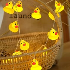 some yellow rubber ducks are hanging in a basket