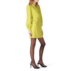 Yellow crepe (62% Polyamide, 6% Elastane, 32% Viscose). Sheath. Long sleeves. V-neckline. Front button closure. Partially lined. 34" from shoulder to hemline. Made in the USA. Classic V-neck Blazer Dress For Semi-formal, Chic V-neck Dress With Buttons, Chic V-neck Single Breasted Mini Dress, Single Breasted V-neck Evening Dress, Silk V-neck Mini Dress For Work, Fitted Green V-neck Dress For Work, Elegant V-neck Dress With Buttons, Fitted V-neck Double-breasted Blazer Dress, Lined V-neck Mini Dress For Work