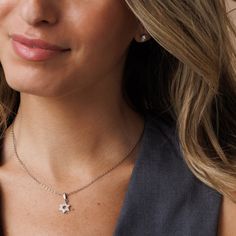 Elevate your style with our Women's Silver Star of David Necklace adorned with a filled zirconia diamond setting. This chic Magen David pendant, made of stainless steel with a dazzling rhodium cover, offers a contemporary reinterpretation of tradition while accentuating its allure with zirconia diamonds. Shower-safe and tarnish-free, it's the ideal accessory for individuals seeking sophistication and elegance. Choose between: A stunning gold hue, crafted from 14K gold-filled material. An elegant silver shade, made of stainless steel with a rhodium cover Star-shaped Cubic Zirconia Jewelry Gift, Dazzling Star-shaped Cubic Zirconia Jewelry, Star-shaped Cubic Zirconia Jewelry With Sparkling Stones, Cubic Zirconia Star Jewelry With Sparkling Stones, Star Shaped Cubic Zirconia Jewelry With Sparkling Stones, Silver Star Of David Charm Jewelry, Cubic Zirconia Jewelry With Star Charm For Gift, Sterling Silver Star Jewelry With Sparkling Stones, Cubic Zirconia Jewelry With Star Charm As Gift