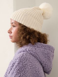 FOR: School, practice, and play FEEL: Warmth-trapping wool-blend yarn feels soft, stretchy, and sturdy FAVE: Faux-fur pom-pom adds whimsical fun to functional winter-wear One size. Cold Weather Hats With Pom Poms, Soft Knit Alpaca Beanie Hat, Beanie With Two Pom Poms, Cold Weather Beanie With Pom Poms, Two Pom Pom Beanie, Bra Dress, Faux Fur Pom Pom, Pom Beanie, Fur Pom Pom