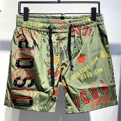 DSQ2 Stickered Quick-Drying Beach Shorts Elevate your wardrobe with these unique DSQ2 Stickered Quick-Drying Beach Shorts that brings not only comfort but style to your wardrobe. We mean unique in more sense than one, a unique labeled color scheme paired with a drawstring look to give you style, comfort, and an amazing look. These printed shorts are designed with a quick-drying fabrication, which makes it stylish and comfortable, after taking a dip in the pool. Product Details: Polyester Beach S Mens Sweat Suits, Military Hoodie, Outdoor Sportswear, Streetwear Jackets, Tracksuit Men, Running Shorts Men, Mens Shorts Summer, Track Suit Men, Tracksuit Jacket