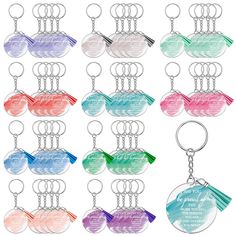 a set of twelve key chains with different colors and designs on each one, including the name