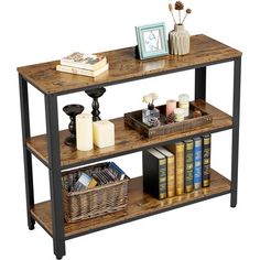 a book shelf with books and candles on it