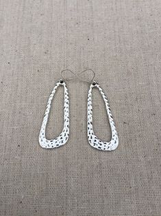 "How cool are these? Sleek mod geometric statement earrings, hang from simple silver ear wire hooks. Made from allergy free plated silver. They have a cool hammered texture which makes them even more unique. These earrings are lightweight and comfortable for everyday wear. They measure 1 5/8\" long by 5/8\" at the widest part. Overall drop length is about 1 3/4\". I can make a matching necklace, if you would like the whole set. Just send me a message and we will make it happen! Thanks for stoppi Geometric Metal Earrings For Everyday, Handmade Modern Teardrop Earrings, Silver Boho Jewelry, Geometric Statement Earrings, Droplet Earrings, Drop Earrings Silver, Silver Statement Earrings, Earrings Big, Big Earrings