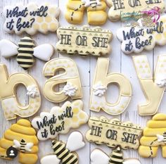 decorated cookies with the words bee and honey on them are laid out next to each other