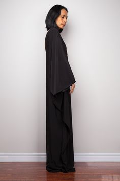 "Black one shoulder dress, Long black kaftan dress, Off shoulder evening dress, black cocktail dress, black party dress, reversible dress PRODUCT SIZE : Free Size * Chest : 40\" will stretch to 44\" * Waist : 40\" will stretch to 44\" * Hips : 40\" will stretch to 44\" * Sleeve length : 23\" * Length : 57\" - 58\" from shoulder to hem (measured when laying flat) MATERIAL : * ITY (polyester jersey) > soft and comfortable to wear, not as slippery as spandex. NOTE : * Model chest : 32\", waist : Black Draped One Shoulder Dress For Formal Occasions, Black Draped One-shoulder Formal Dress, Black Draped One Shoulder Formal Dress, Black One-shoulder Floor-length Party Dress, Black Floor-length One Shoulder Party Dress, Black One Shoulder Floor-length Party Dress, Elegant Abaya With Cape Sleeves For Evening, Elegant Evening Abaya With Cape Sleeves, Elegant Evening Thobe In Maxi Length