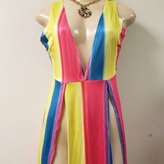 Long Multicolored Dress With Two Side Splits And A V Cut Front Very Sexy This Dress Comes Pass The Ankle True To Size Mannequin Has On A Small Trendy Multicolor Maxi Dress For Night Out, Yellow Stretch Maxi Dress For Night Out, Stretch Yellow Maxi Dress For Night Out, Yellow V-neck Mini Dress For Beach Season, Multicolor Maxi Dress For Club, Summer Party Maxi Dress With Color Block, Summer Party Color Block Maxi Dress, Trendy Yellow V-neck Mini Dress, Multicolor V-neck Mini Dress For Club