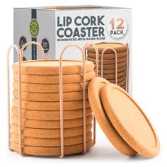 a stack of 12 cork coasters in front of a cardboard box with the lid open