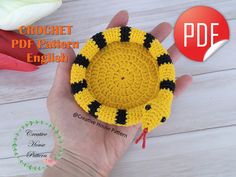 a crochet pattern for a yellow and black object