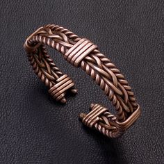 "Men bangle bracelet with twisted braided fired wire wrapped pure copper  , unisex bracelet. Copper is patinated to give it an antique appearance . Please read about copper care on Info & Faq section. Bracelet width 1.5 cm - 0.6\" The requested piece it's made similar with the original shown item , so may shown some small differences but I always do my best for a perfect similar look . Please be sure to read the entire description of the item before you purchase. Item images may seem larger due Metal Bracelets Handmade, Handmade Copper Wire Cuff Bracelet Bangle, Handmade Copper Wire Bangle Bracelet, Elegant Hand Wrapped Copper Bangle, Male Bracelets, Men Bangle, Anniversary Bracelet, Copper Jewelry Diy, 100% Copper Braclet