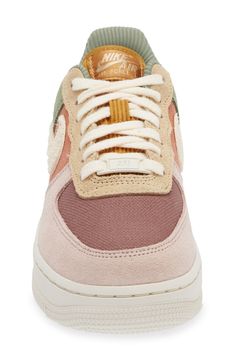 The basketball shoe that started a sensation keeps shooting and scoring as a street sneaker sporting layers of plush suede and colorblocked canvas. The iconic Air Force 1 sole features embedded Nike Air cushioning and crenellations along the tread that frame a star-studded bumper toe. Lace-up style Removable insole Leather, synthetic and textile upper/textile lining/rubber sole Imported Nordstrom x Nike: A curated lifestyle destination where fashion is the ultimate sport Nike Air Force Sage, Colored Nike Air Forces, Air Maxs Nike, Nike Air Force Mid 77, Nike Air Force 1 With Flowers, Nike Air Cushion Sneakers, Air Force 1 Shoes Stadium Goods, Air Force1 Shoes, Air Force 1 Mid Nike