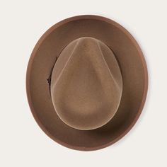 An icon of the Stetson brand, the Whippet Fedora epitomizes the sophisticated style of the American post-war era with its timeless, versatile profile and a brim that can look casual and cool when snapped up, or snapped down for a dressed-up and dapper look. Handcrafted with a firm finish from high-quality 100% wool felt and richly dyed in versatile shades, the Whippet features a slightly tapered 4 ½" pinch front teardrop crown and a 2 ⅜” bound edge brim. Its classic style is underscored by a gro Wool Fedora Hat, Wool Fedora, Denim Boots, Casual Bottoms, Wide Trousers, Thigh Boot, Cool Hats, Whippet, Hat Band