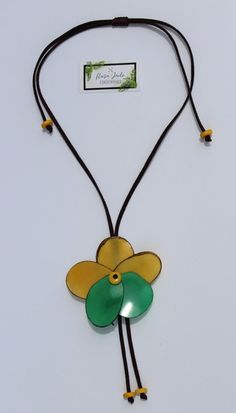 Handmade in Ecuador Necklace Length: 15 -35.5 Adjustable Length Material: Tagua Nut Handmade Clasp Due to this item being handmade and the nature of the Tagua Nut the size and the color may vary from piece to piece Handmade Brown Flower Jewelry, Yellow Flower Necklace For The Beach, Yellow Flower Necklace For Beach, Bohemian Brown Flower Necklace, Adjustable Yellow Flower Pendant Necklace, Yellow Adjustable Flower Pendant Necklace, Brown Flower-shaped Jewelry Gift, Nature-inspired Brown Flower-shaped Jewelry, Handmade Brown Flower Pendant Jewelry