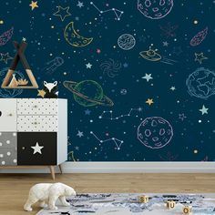 a child's room with space themed wallpaper and toy animals on the floor