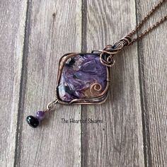 This stunning, chatoyant stone of Charoite has a beautiful mix of purple, white, black, and brown. It is wrapped in oxidized copper wire. A dangle of Amethyst and faceted Black Spinel hangs from the bottom. It comes on a copper chain or black leather cord in a choice of lengths. CHAROITE is a stone of transformation. It is the soul stone that overcomes fear. Charoite stimulates inner vision and spiritual insight and aids in coping with enormous change at a spiritual level. To facilitate this, it synthesizes the heart and crown chakra's, cleanses the aura, and stimulates unconditional love. BLACK SPINEL is a protective stone that repels negativity and grounds the user while evoking inspiration and empowerment, without overwhelming others. It is also thought to help one find calmness and let Unique Hand Forged Purple Necklaces, Artisan Purple Wire Wrapped Jewelry, Handmade Fluorite Pendant Jewelry, Artisan Amethyst Wire Wrapped Jewelry, Bohemian Amethyst Soldered Necklace, Handmade Purple Copper Jewelry, Bohemian Amethyst Necklace, Artisan Purple Hand Wrapped Jewelry, Artisan Hand Wrapped Purple Jewelry