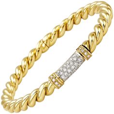 Embrace the timeless elegance of the Rope Bangle from the traditional Micheletto collection, meticulously crafted in luxurious 18 karat yellow gold and adorned with sparkling white diamonds. This exquisite piece combines classic design with sophistication, making it a versatile addition to any jewelry collection. Features: Material: 18 Karat Yellow Gold Total Gold Weight: 21 grams Diamond Details: 0.55 carats total weight, GH color, VVS1 clarity Design: Rope motif with inset white diamonds Stamp Luxury Yellow Gold Diamond Bracelet With Brilliant Cut, Luxury Brilliant Cut Yellow Gold Diamond Bracelet, Luxury Diamond Bracelet In Yellow Gold, Luxury Yellow Gold Diamond Chain Bracelet, Luxury Yellow Gold Bracelet With Brilliant Cut, Elegant Yellow Gold Diamond Bracelet With Accents, Luxury Brilliant Cut Yellow Gold Bracelet, Elegant Gold Bracelet With Diamond Accents In Diamond White, Luxury Yellow Gold Diamond Bracelet With Single Cut