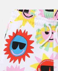 Playful Yellow Summer Shorts, Playful Summer Shorts, White Graphic Print Bottoms For Beach Season, Graphic Print Cotton Summer Bottoms, Multicolor Graphic Print Summer Bottoms, Playful Graphic Print Beach Bottoms, Playful White Shorts For Beach Season, Multicolor Graphic Print Summer Shorts, Fun White Bottoms For Vacation