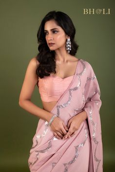 Expertly crafted with high quality Georgette fabric, this partywear saree is designed to make a statement. The elegant pink color and delicate sequin embellishments add a touch of glam to any occasion. Shine bright while feeling comfortable and confident in this must-have saree. Festive Pre-draped Sequined Dola Silk Saree, Sequin Pre-draped Chinon Saree, Diwali Party Pre-draped Tissue Silk Saree, Party Wear Pre-draped Saree With Unstitched Blouse, Pre-draped Tissue Silk Saree With Dupatta For Party, Pink Pre-draped Tissue Silk Saree With Unstitched Blouse, Pink Tissue Silk Pre-draped Saree With Unstitched Blouse, Party Pre-draped Chinon Saree With Mirror Work, Designer Pink Pre-draped Saree With Zari Work