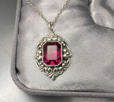 Nice vintage German pendant with a faceted violet glass stone. 1950s. Silver 835. Total length with eyelet approx. 3 cm. Width 2 cm. Good used condition. Nice genuine old piece with wear! Floats from approx. 18-inch long vintage 925 silver chain! Total weight (with chain): 5.7g Material: 835 silver Box on photos is NOT included! Vintage Formal Birthstone Jewelry, Vintage Jewelry With Rectangular Pendant For Formal Occasions, Vintage Formal Jewelry With Large Pendant, Vintage Ruby Necklace For Formal Occasions, Vintage Silver Jewelry With Birthstone, Vintage Silver Birthstone Jewelry, Vintage Jewelry With Round Birthstone Pendant, Vintage Rectangular Pendant Jewelry For Formal Occasions, Vintage Birthstone Necklace For Weddings