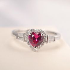 All HANDMADE ITEMS SHIP IN APPROX 8 DAYS Main Stone: Lab created ruby Main Stone Size: Heart cut 6 mm x 6mm Main Stone Weight: 1.16 carat Side Stone: CZs Height From The Ring Setting Bottom(to gemstone top): about 5.25 mm Width of Ring band Measure: gradually varied,about 2.08 to 2.31 mm Material: .925 Sterling Silver/14K White Gold/14K Yellow Gold/14k Rose Gold Engraved: Available For FreeNo more than 13 letters) Customized:Of course! Tell me what you want Includes With Order: All of my store i Heart-shaped White Gold Birthstone Ring For Valentine's Day, Red Diamond Heart Ring For Anniversary, Red Heart Diamond Ring For Anniversary, Red Heart Shaped Diamond Anniversary Ring, Heart-shaped Diamond Ring For Anniversary, Red Heart Ring With Center Stone, Heart-shaped Silver Ruby Ring For Valentine's Day, Red Heart-shaped Rings With Center Stone, Red Heart-shaped Diamond Ring