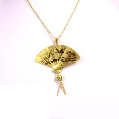 "1970s Large folding fan necklace 14kt gold plated with your choice of chain size 16\", 18\" or 20\"at no additional charge. The fan measures approximately 2\" wide by 2 1/4\" high with a scene of etched cranes taking flight and landing. In the Chinese culture fans were worn made of different materials to represent wealth and status. The  flying cranes in Japanese culture are symbols of good fortune and longevity. This particular style of cross has a brooch type pin on back to secure it if you w Retro Gold-tone Jewelry For Gift, Retro Gold-tone Jewelry Gift, Retro Gold Necklace As A Gift, Retro Gold Necklace For Gift, Retro Gold Necklace Gift, Retro Gold Nickel-free Jewelry, Retro Nickel-free Gold Jewelry, Retro Gold Medallion Jewelry, Retro Gold Jewelry For Gifts