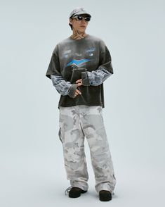 The Distressed Layered Washed Long-Sleeve Tee brings a bold, avant-garde touch to casual streetwear. Featuring a washed and distressed finish, this piece embodies a well-worn, vintage look with a modern twist. The front graphic print adds a unique focal point, while the classic crew neck design and slightly oversized fit offer a laid-back vibe. Crafted from premium 100% cotton fabric, this tee is both stylish and comfortable, making it a must-have for those who appreciate edgy, fashion-forward p Acid Wash Tops For Winter Streetwear, Urban Acid Wash Tops For Fall, Casual Acid Wash Top For Streetwear, Casual Long Sleeve Stonewashed Tops, Acid Wash Long Sleeve Tops For Streetwear, Edgy Faded Tops For Streetwear, Casual Acid Wash Tops For Winter, Ripped Relaxed Fit Tops For Streetwear, Casual Washed Tops For Streetwear