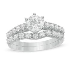 An effortless classic, this diamond bridal set is a beautiful symbol of your love. Crafted in cool 10K white gold, the quintessential engagement ring showcases a 3/4 ct. diamond sparkling atop a diamond-lined shank. Additional diamonds adorn the gallery. Complete her look with contoured diamond-lined wedding band. Captivating with 1-1/2 cts. t.w. of diamonds and a bright polished shine, this bridal set complements her unique style - today and always. Classic Diamond White Solitaire Bridal Sets, Diamond White Solitaire Bridal Sets For Promise, Diamond Solitaire Bridal Sets With Round Band, White Gold Bridal Set With Solitaire Round Cut, Anniversary Solitaire Moissanite Bridal Sets, Anniversary Moissanite Solitaire Bridal Sets, Classic Bridal Sets With Diamond Center Stone, Solitaire Round Cut Diamond Bridal Sets, White Moissanite Bridal Sets With Brilliant Cut