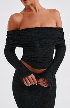 This slightly sheer, sexy top looks amazing paired with maxis, minis or your fave denim. Crafted in our premium stretch floral lace and fully lined in mesh, it features a gathered fold-over neckline and long sleeves with flared cuffs.


Colour: Black.

Premium stretch floral lace.

Fully lined.

Gathered neckline.

Fold over detail at neckline.

Off the shoulder styling.

Shaped hem.

Long sleeves with flared cuffs.

Cropped length.

Model is an XS and is wearing an XS.

 Size: XS, S, M, L, XL, Sheer Fitted Mesh Top For Date Night, Chic Fitted Mesh Top For Date Night, Stretch Lace Mesh Top For Party, Fitted Tops With Mesh Sleeves For Evening, Spring Fitted Lace Mesh Top, Elegant Stretch Lace Mesh Top, Fitted Lace Flirty Top, Chic Fitted Long Sleeve Mesh Top, Fitted Long Sleeve Chic Mesh Top