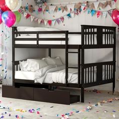 there is a bunk bed with two drawers underneath it and balloons in the air above