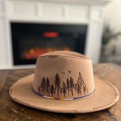 Beautiful Hand Burned Fedora Hat. Beautiful Southwestern Style With Mountains.Beaded Rim Bohemian Flat Brim Felt Hat For Outdoor, Bohemian Style Flat Brim Felt Hat For Outdoor, Bohemian Hat Bands For Outdoor Fall Events, Southwestern Fedora Hat For Outdoor, Southwestern Style Fedora For Outdoor, Southwestern Fedora For Outdoor, Brown Bohemian Felt Hat For Outdoor, Bohemian Brown Felt Hat For Outdoor, Burned Hats For Women